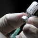 A health care worker extracting a dose of the covid-19 Pfizer/BioNtech vaccine